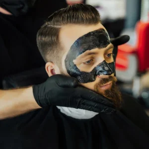 barber-applies-black-charcoal-mask-man-face-clean-pore-skin-remove-acne-from-nose-barbershop_356893-894.jpg